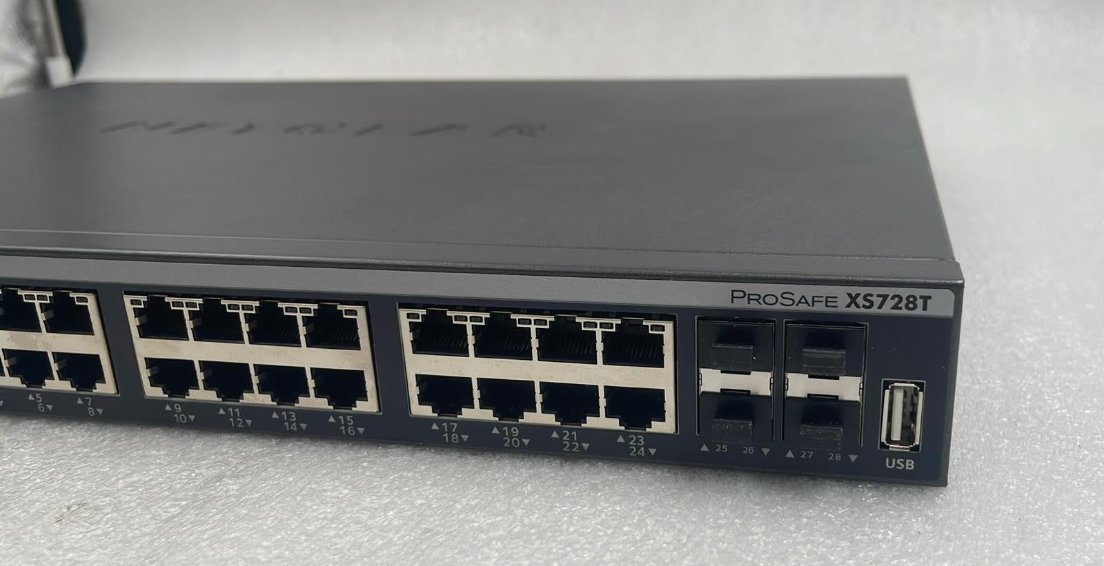 Netgear XS728T-100NES 28-port 10-Gigabit smart managed Pro network switch front panel view