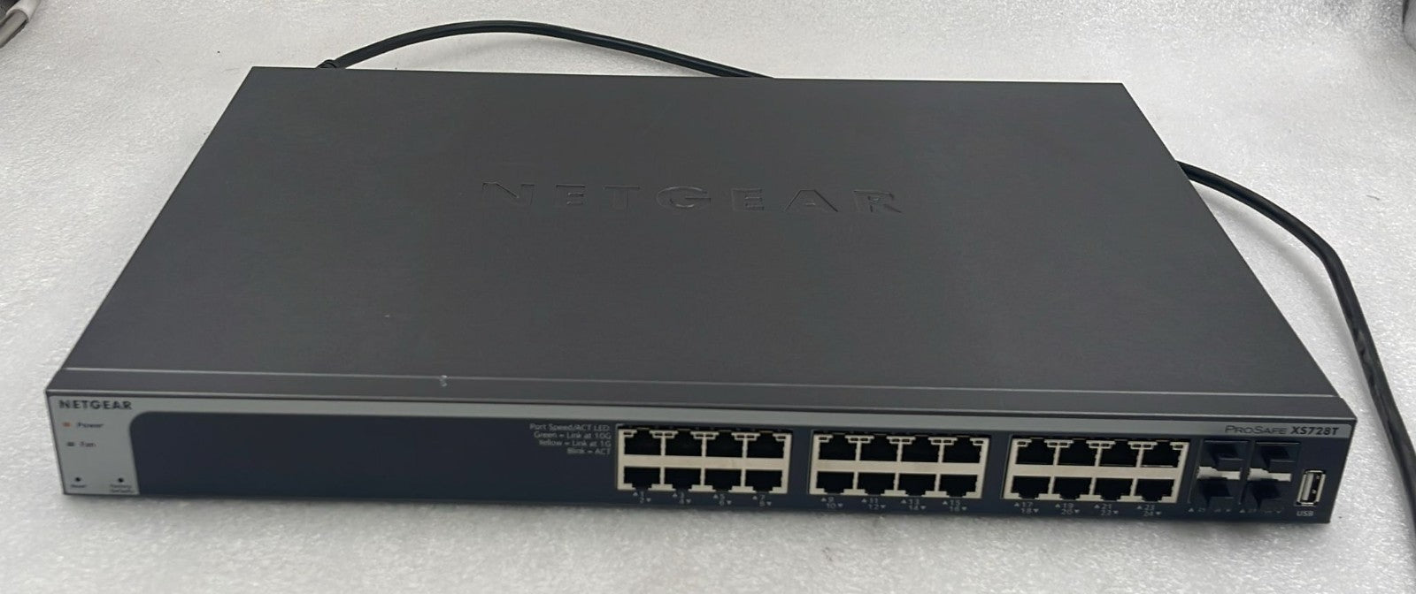 Netgear XS728T-100NES switch front panel Ethernet ports