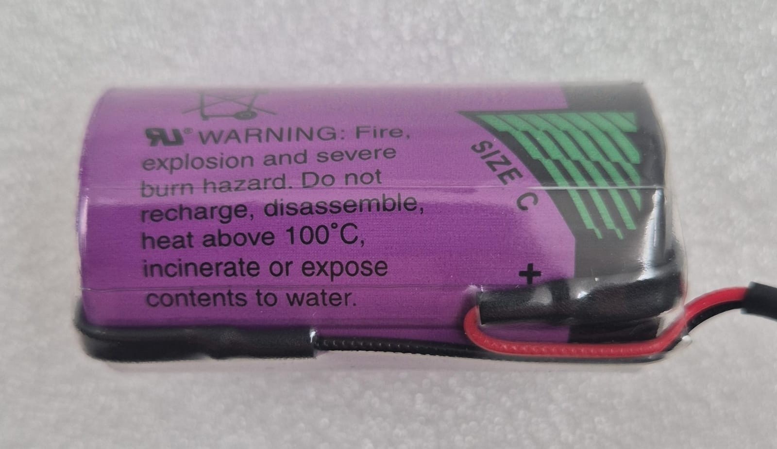 Tadiran TL-5920 lithium inorganic battery Size C 3.6V with attached wire leads side view