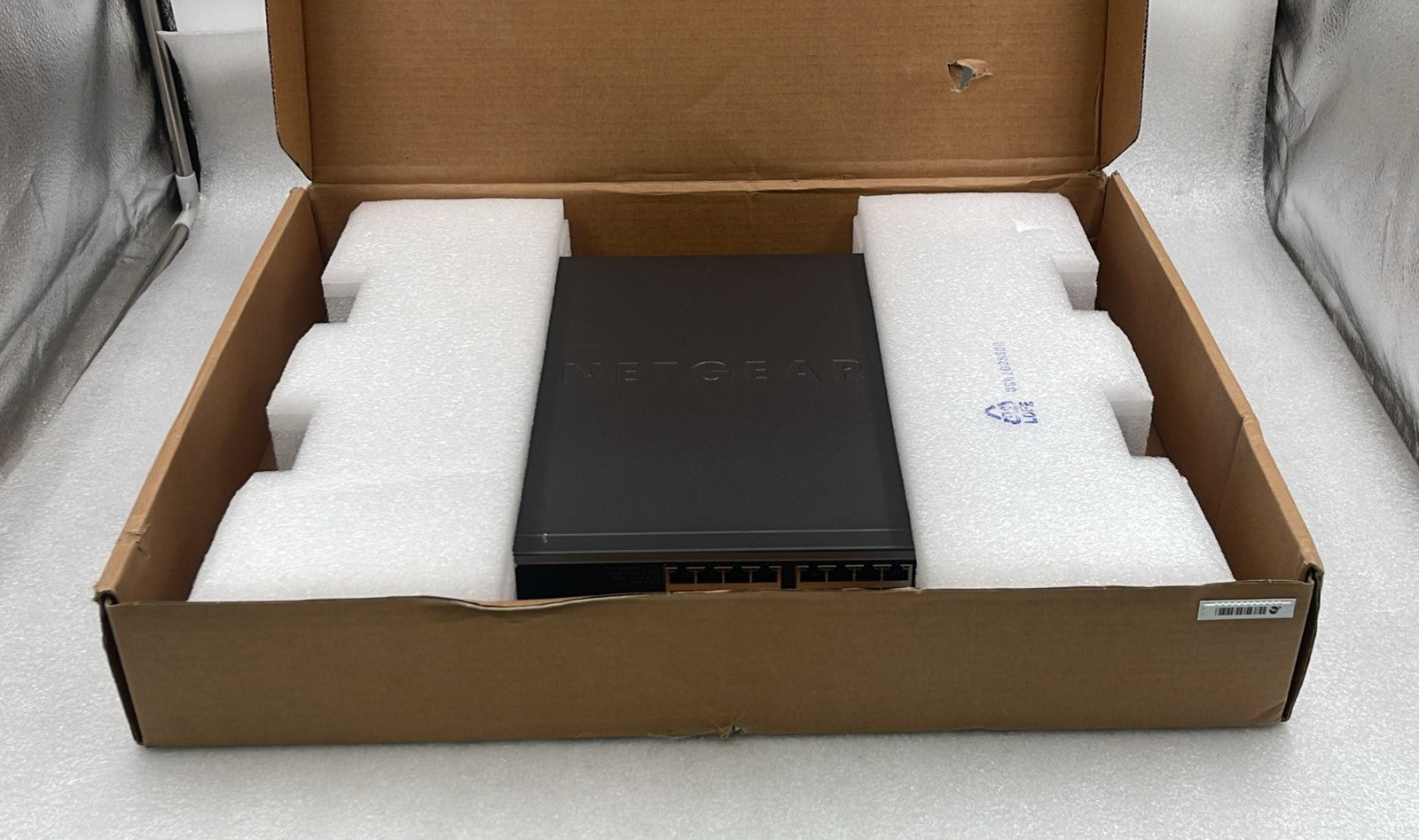 Netgear XS728T-100NES open box with protective foam