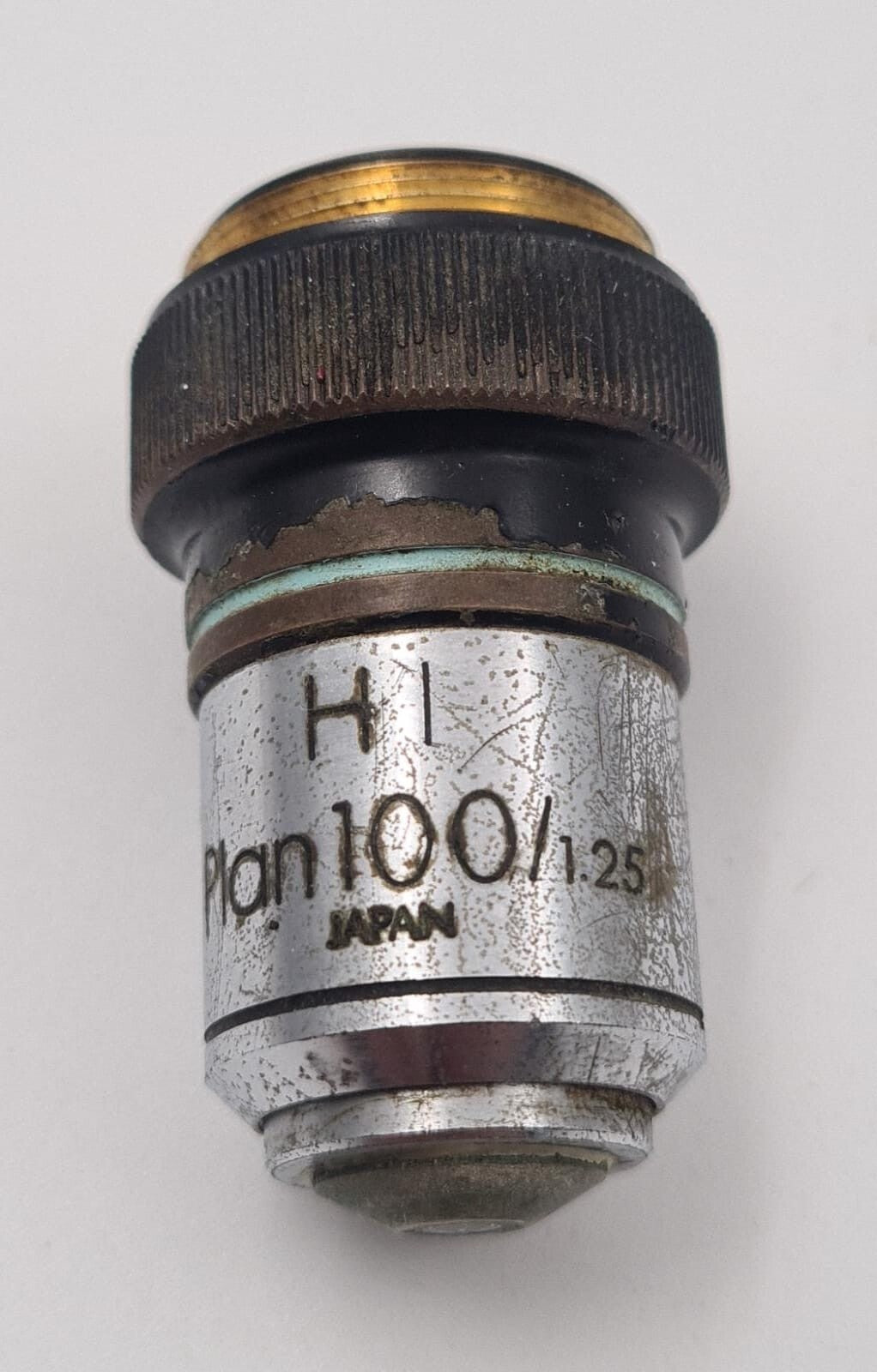 Olympus HI PLAN 100x 1.25 NA microscope objective lens close-up