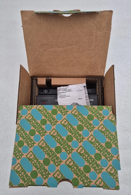 Open cardboard box with patterned flap on a gray background