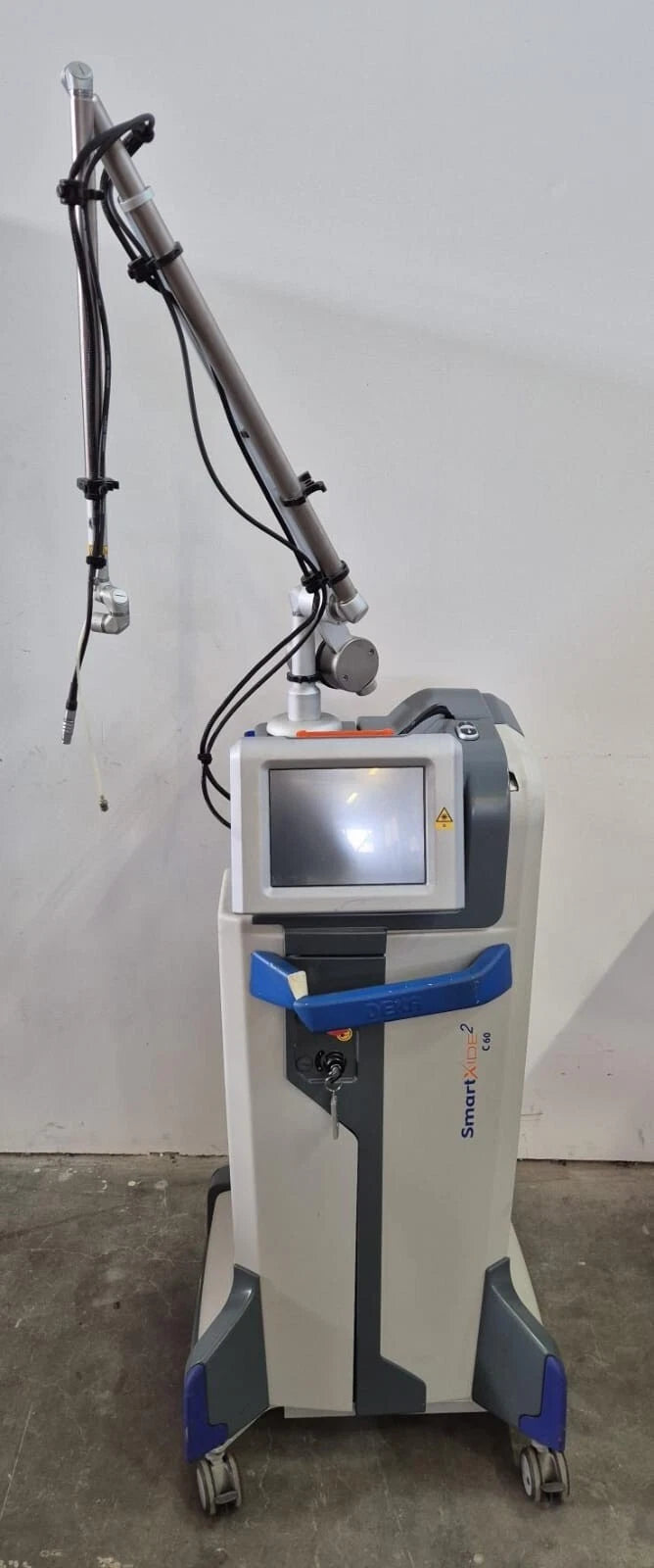 DEKA Smartxide2 M103P1 C60 MonaLisa Touch CO2 laser system with articulated arm and touchscreen interface